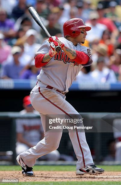 Felipe Lopez of the Arizona Diamondbacks follows through on his game winning RBI single to centerfield off of starting pitcher Ubaldo Jimenez of the...