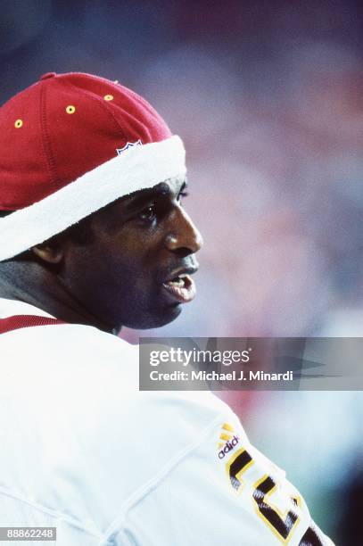 Cornerback Deion Sanders of the Washington Redskins looks over his opponents before a preseason game with the Baltimore Ravens at Fed Ex Field on...