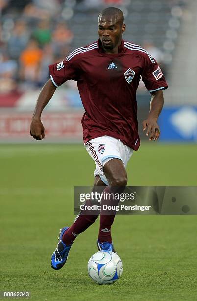 Omar Cummings of the Colorado Rapids controls the ball against FC Dallas during MLS action at Dick's Sporting Goods Park on June 24, 2009 in Commerce...