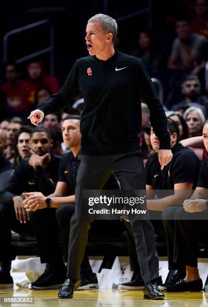 Head coach Andy Enfield of the USC Trojans calls for a foul on the Oklahoma Sooners during the Basketball Hall of Fame Classic at Staples Center on...