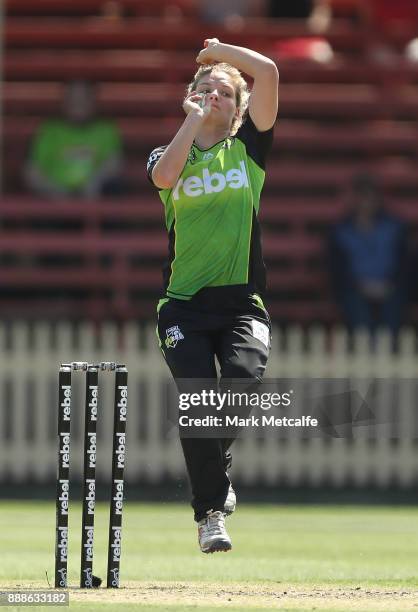 Nicola Carey of the Thunder bowls during the Women's Big Bash League WBBL match between the Melbourne Renegades and the Sydney Thunder at North...