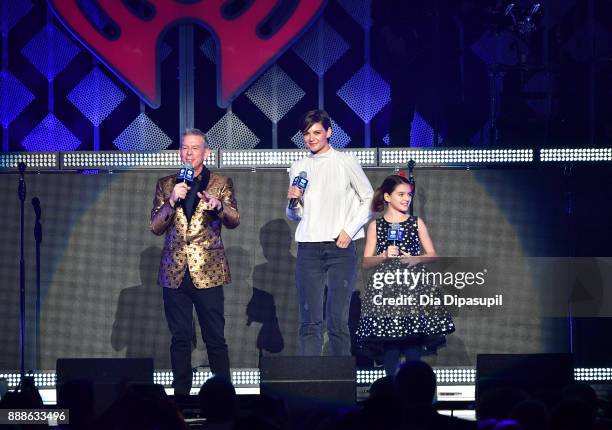 Elvis Duran, Katie Holmes and Suri Cruise speak performs onstage at the Z100's Jingle Ball 2017 on December 8, 2017 in New York City.