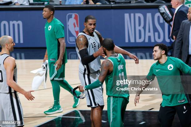 LaMarcus Aldridge of the San Antonio Spurs and Kyrie Irving of the Boston Celtics shake hands after the game on December 8, 2017 at the AT&T Center...