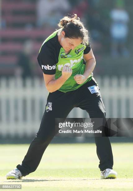 Rene Farrell of the Thunder celebrates taking the wicket of Claire Koski of the Renegades during the Women's Big Bash League WBBL match between the...