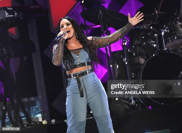Demi Lovato performs at the Z100's iHeartRadio Jingle Ball 2017 at Madison Square Garden on December 7, 2017 in New York. / AFP PHOTO / ANGELA WEISS