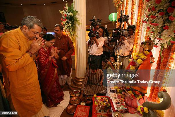 Soneji, Chief Operating Officer of Bombay Stock Exchange with his wife doing Lakshmi Puja at BSE office in Mumbai, Maharashtra, India ( ML Sony,Chief...
