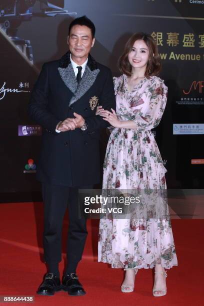 Actor Simon Yam and singer and actress Charlene Choi arrive on the red carpet of the 2nd International Film Festival & Awards Ceremony on December 8,...