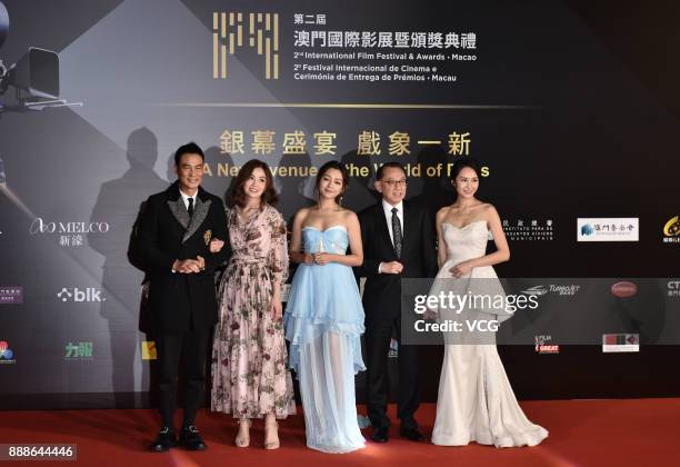 Actor Simon Yam, singer and actress Charlene Choi, actress Michelle Wai, Chairman of Emperor Group Albert Yeung and actress Kathy Tong arrive on the...