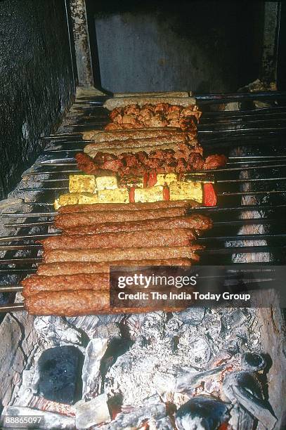 Kebabs, PaneerTikka and Chicken Tikka are fried on an Oven