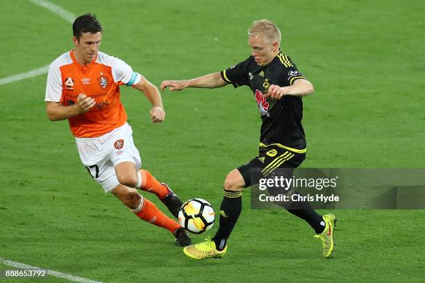 Adam Parkhouse of the Phonenix and Matt McKay of the Roar compete for the ball during the round 10 A-League match between the Brisbane Roar and the...