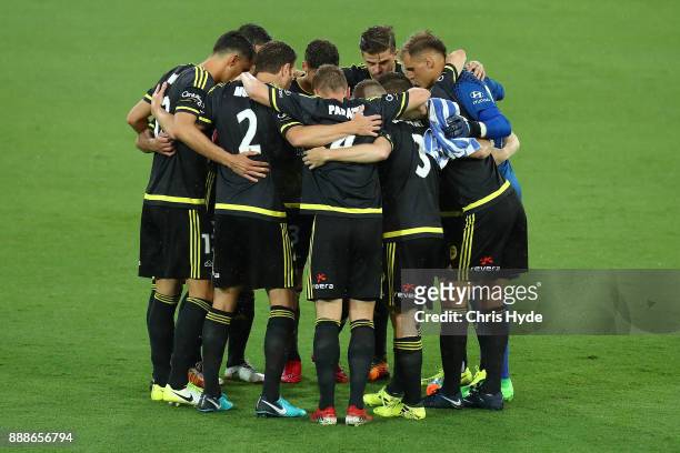 Phoenix huddle before the round 10 A-League match between the Brisbane Roar and the Wellington Phoenix at Cbus Super Stadium on December 9, 2017 in...