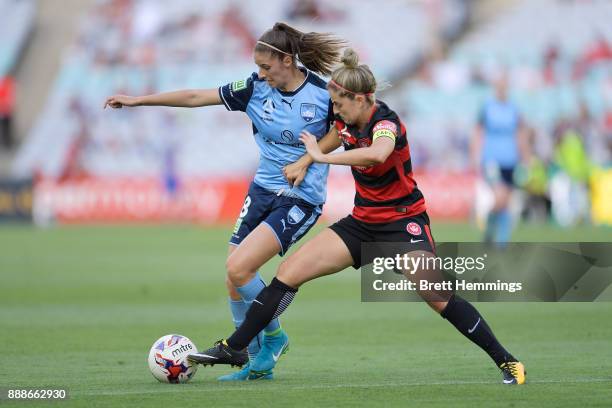 Amy Harrison of Sydney is tackled Ellie Brush of the Wanderers during the W-League match between the Western Sydney Wanderers and Sydney FC at ANZ...