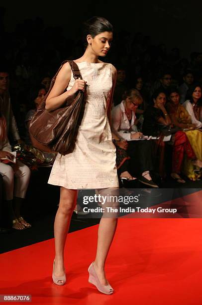 Model walks on the ramp with Fashion Designers Levi's Gen Next outfit at the Lakme Fashion Week-2008 in Mumbai, Maharashtra, India