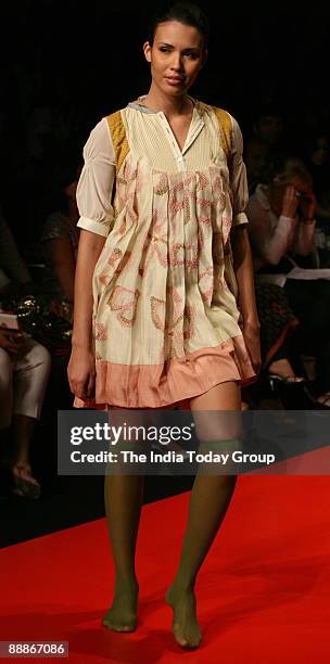 Model walks on the ramp with Fashion Designers Levi's Gen Next outfit at the Lakme Fashion Week-2008 in Mumbai, Maharashtra, India