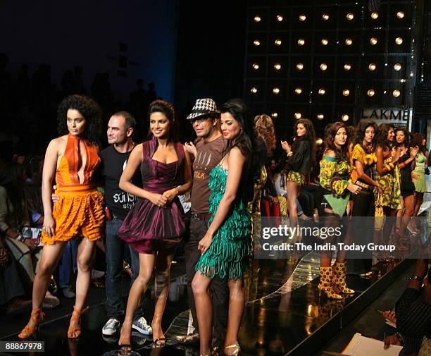 Priyanka Chopra along with Mugdha Godse, Kangna Ranaut, Fashion Designer Narendra Kumar and hair stylist Andrew Barton are walking on the ramp with...