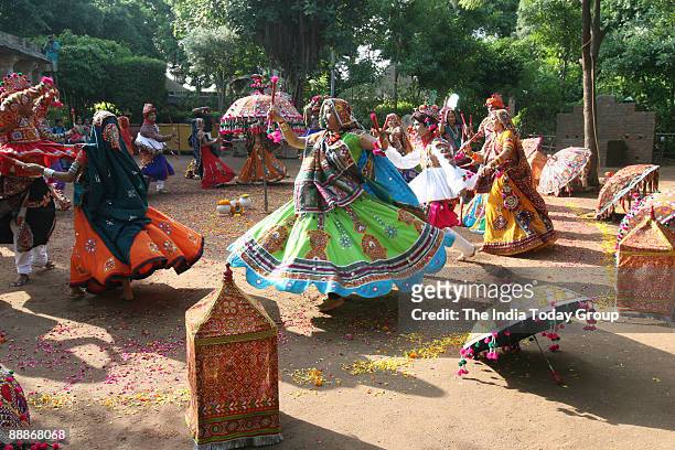 Young boys and Girls performing Dandia at Navratri Festival in Ahmedabad, Gujarat, India