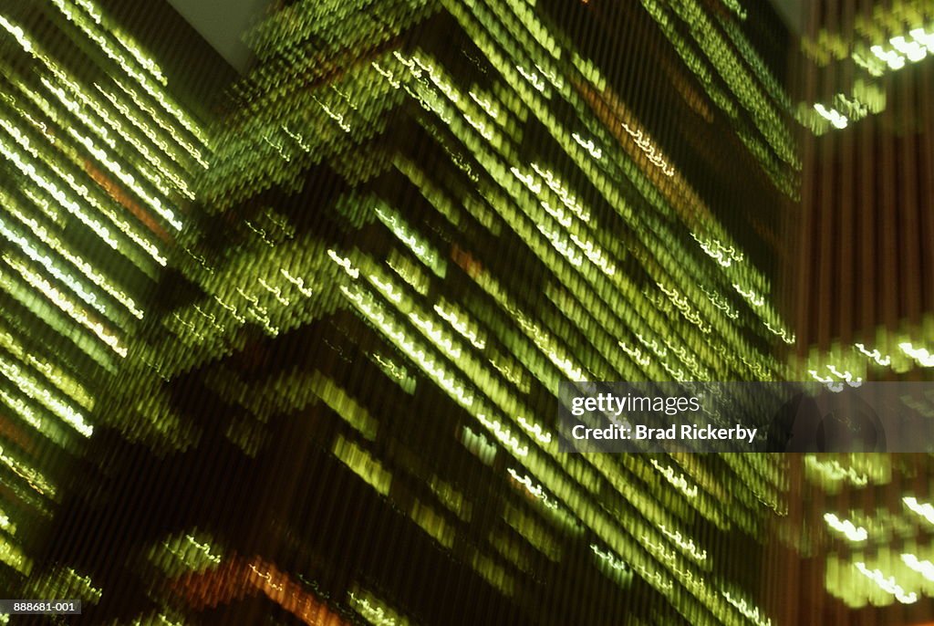 USA, New York City, skyscrapers at night (blurred motion)