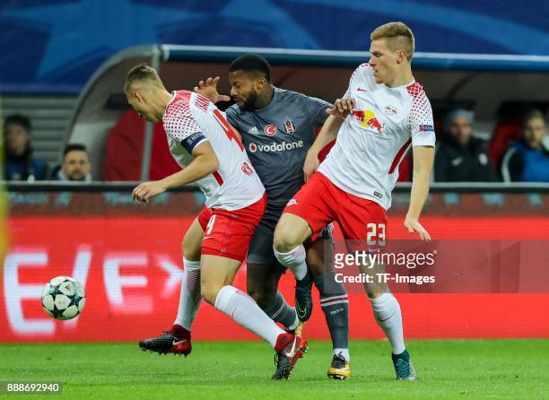 Willi Orban of Leipzig Marcel Halstenberg of Leipzig and Jeremain Lens of Besiktas battle for the ball during the UEFA Champions League group G...
