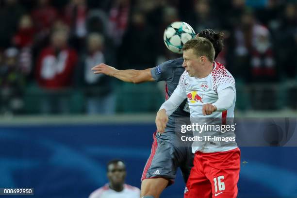 Mustafa Pektemek of Besiktas and Lukas Klostermann of Leipzig battle for the ball during the UEFA Champions League group G soccer match between RB...