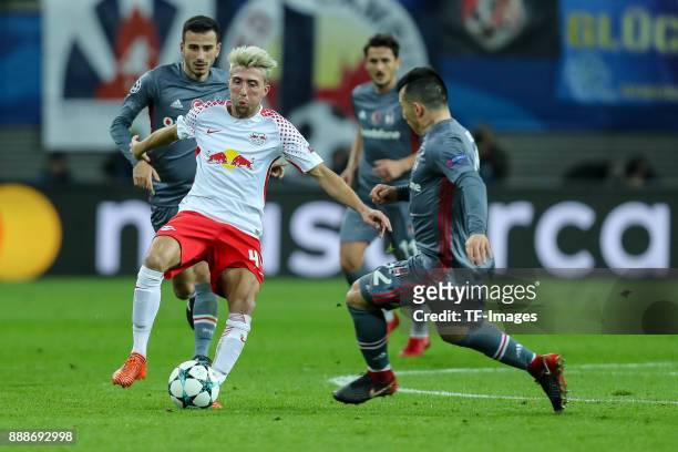 Kevin Kampl of Leipzig and Gary Medel of Besiktas battle for the ball during the UEFA Champions League group G soccer match between RB Leipzig and...