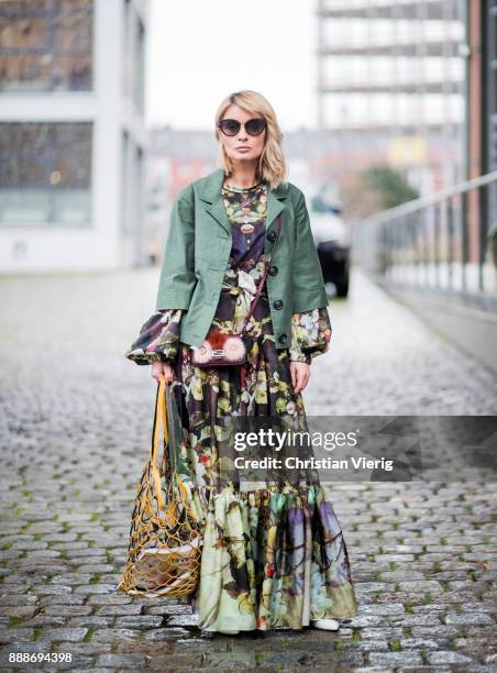 Gitta Banko wearing a silk, tiered maxi dress with bell sleeves by Uli Herzner, palm-green, jeans by Citizen of Humanity, short leather jacket by...