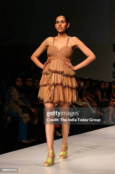 Model walks on the ramp with Fashion Designer Sailex outfit at the Lakme Fashion Week-2008 in Mumbai, Maharashtra, India