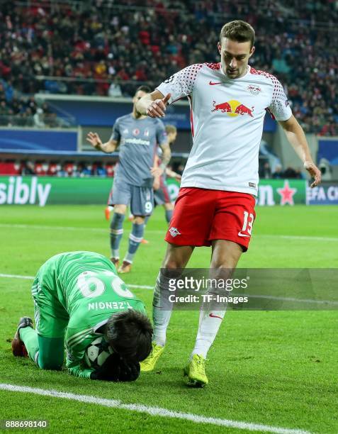 Goalkeeper Tolga Zengin of Besiktas and Stefan Ilsanker of Leipzig battle for the ball during the UEFA Champions League group G soccer match between...