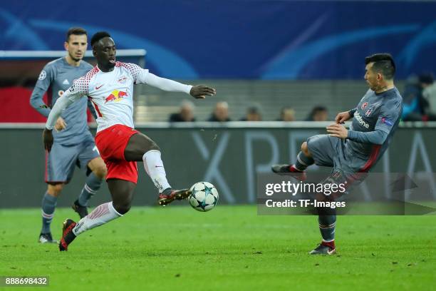 Jean-Kevin Augustin of Leipzig and Gary Medel of Besiktas battle for the ball during the UEFA Champions League group G soccer match between RB...