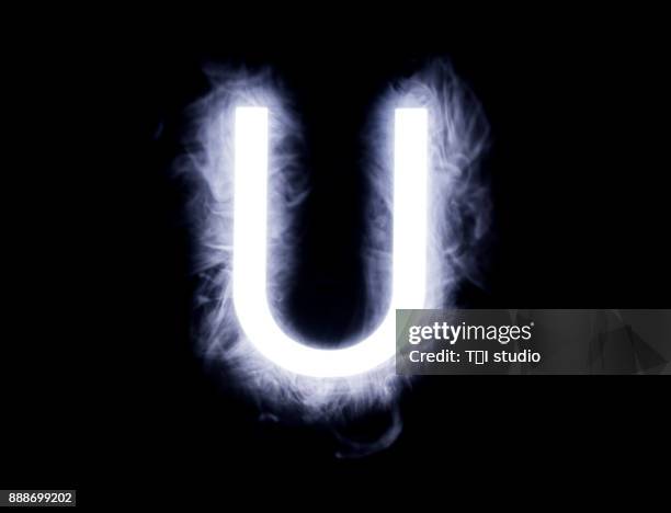 alphabet black background - letter u stock pictures, royalty-free photos & images