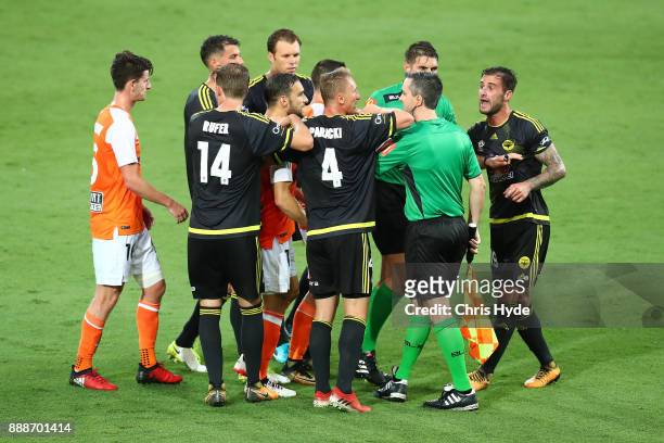 Tom Doyle of the Phoenix is handed a yellow card during the round 10 A-League match between the Brisbane Roar and the Wellington Phoenix at Cbus...