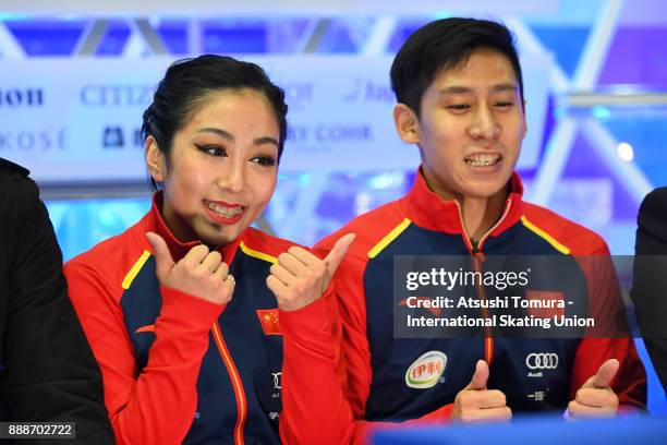 Wenjing Sui and Cong Han of China smiles at the kiss and cry after competeing in the Pairs free skating during the ISU Junior & Senior Grand Prix of...