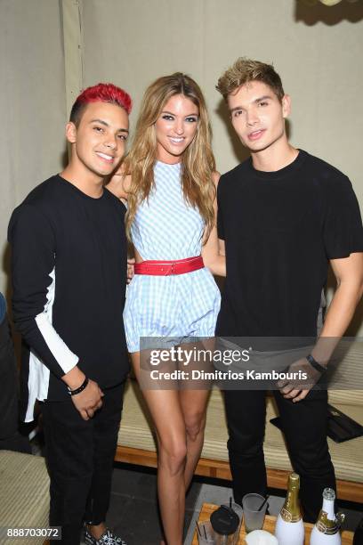 Martha Hunt, Christian Acosta and guest attend the Maxim December Miami Issue Party Presented by blu on December 8, 2017 in Miami Beach, Florida.