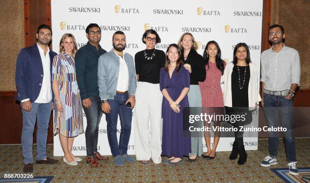 Costume designer Alexandra Byrne and guests pose after her Masterclass on day four of the 14th annual Dubai International Film Festival held at the...