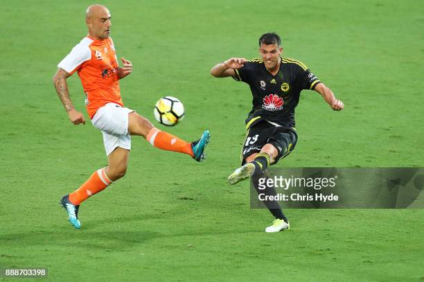 Massimo Maccarone of the Roar and Marco Rossi of the Phoenix compete for the ball during the round 10 A-League match between the Brisbane Roar and...