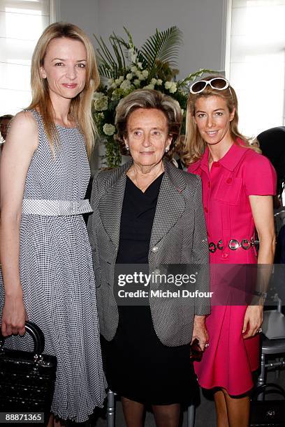 Delphine Arnault, Bernadette Chirac and Mrs Ortefeux attends the Christian Dior Fashion Show during fashion week on July 6, 2009 in Paris, France.