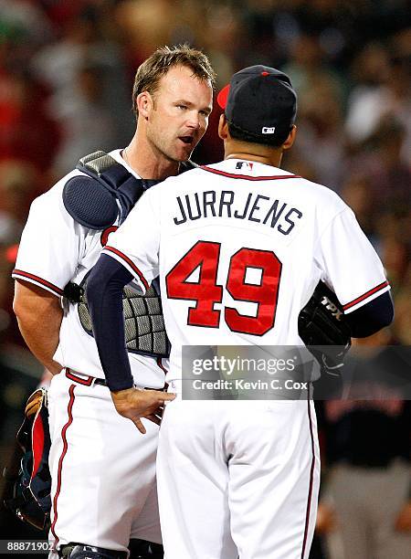 Starting pitcher Jair Jurrjens and catcher David Ross of the Atlanta Braves against the Boston Red Sox at Turner Field on June 26, 2009 in Atlanta,...