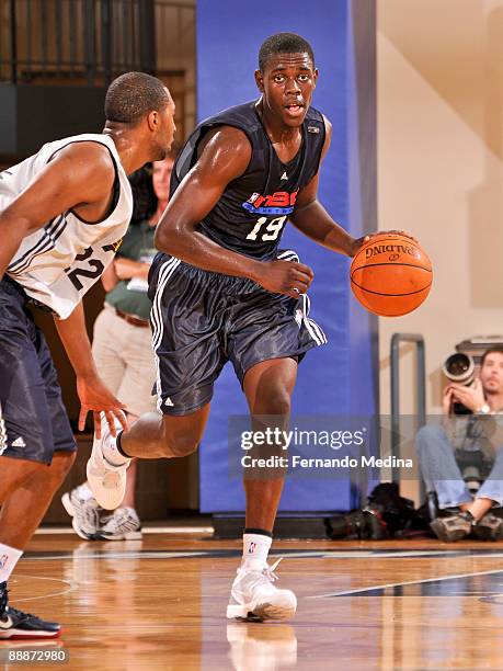 Jrue Holiday of the New Jersey Nets/Philadelphia 76ers dribbles against the Indiana Pacers during the game on July 6, 2009 at the RDV Sportsplex in...