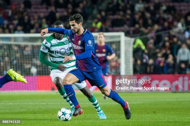 Andre Filipe Tavares Gomes of FC Barcelona competes for the ball with William Carvalho of Sporting CP during the UEFA Champions League 2017-18 match...