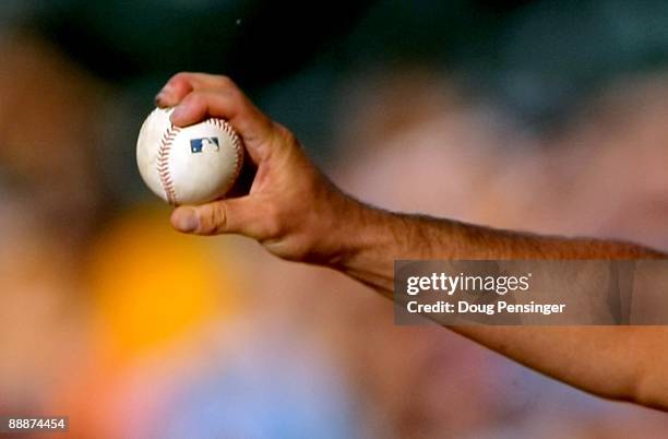 Detail phoot of starting pitcher Jason Marquis of the Colorado Rockies delivers against the Washington Nationals during MLB action at Coors Field on...