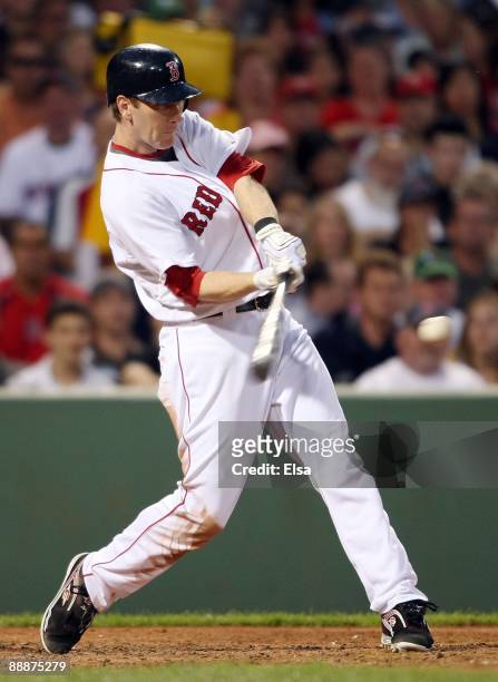 Jason Bay of the Boston Red Sox gets a hit against the Oakland Athletics on July 6, 2009 at Fenway Park in Boston, Massachusetts. The Athletics...
