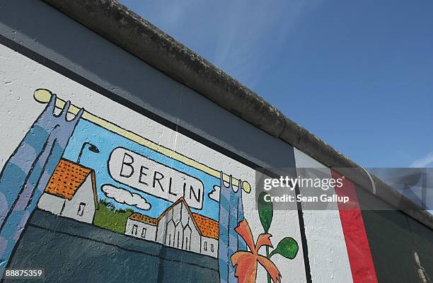 Murals decorate a surviving portion of the former Berlin Wall known as the East Side Gallery on July 7, 2009 in Berlin, Germany. The Berlin Wall was...