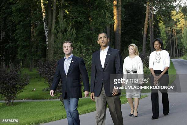 Russian President Dmitry Medvedev and his wife Svetlana meet with US President Barack Obama and his wife Michelle outside Moscow in Gorki on July 6,...