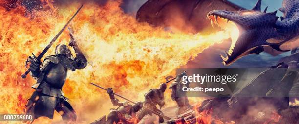medieval knights with weapons attacked by fire breathing dragon - fantasy dragon stock pictures, royalty-free photos & images