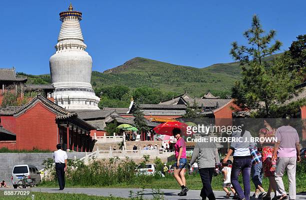 To go with AFP story by Robert J. Saijet: CHINA-RELIGION-BUDDHISM Visitors make their way to visit temple complexes at Wutaishan on June 24, 2009 in...