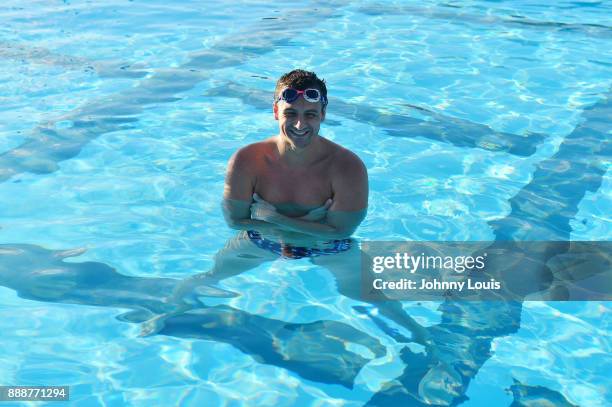 Ryan Lochte working on stroke definition with teens and babies who learned to swim through Baby Otter at Central Park Aquatic Complex on December 03,...