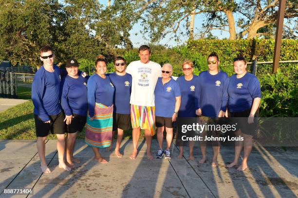 Ryan Lochte working on stroke definition with teens and babies who learned to swim through Baby Otter at Central Park Aquatic Complex on December 03,...