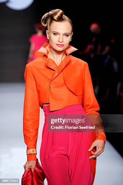 Model walks down the runway at the 'Smililener Show' during the Mercedes-Benz Fashion Week Berlin S/S 2010 at Bebelplatz on July 3, 2009 in Berlin,...