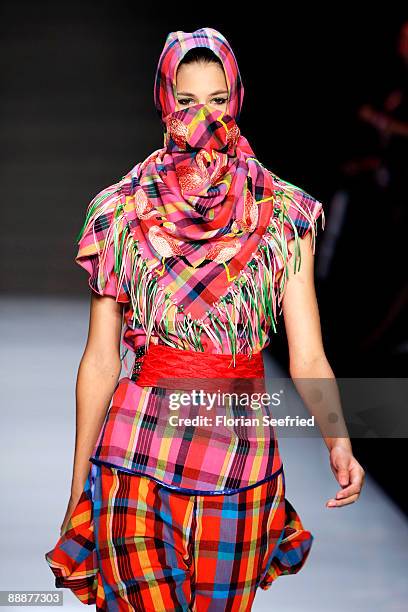 Model walks down the runway at the 'Smililener Show' during the Mercedes-Benz Fashion Week Berlin S/S 2010 at Bebelplatz on July 3, 2009 in Berlin,...