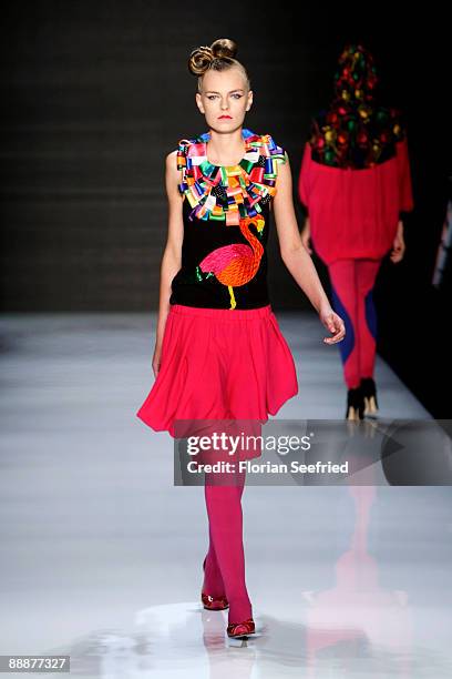 Model walks down the runway at the 'Smililener Show' during the Mercedes-Benz Fashion Week Berlin S/S 2010 at Bebelplatz on July 3, 2009 in Berlin,...