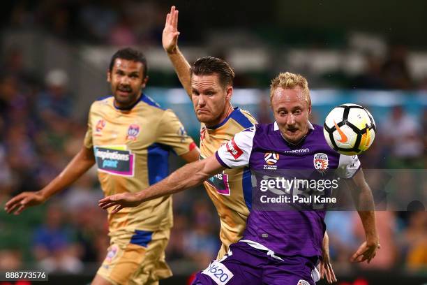 Mitch Nichols of the Glory controls the ball against Nigel Boogaard of the Jets during the round 10 A-League match between the Perth Glory and the...